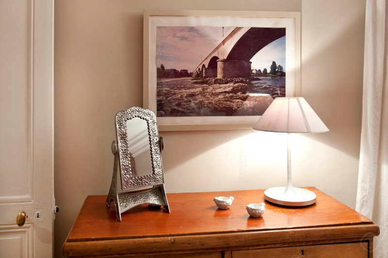 Bedroom with Wall Artwork, Mirror and Lamp Chic Saint Germain apartment Paris