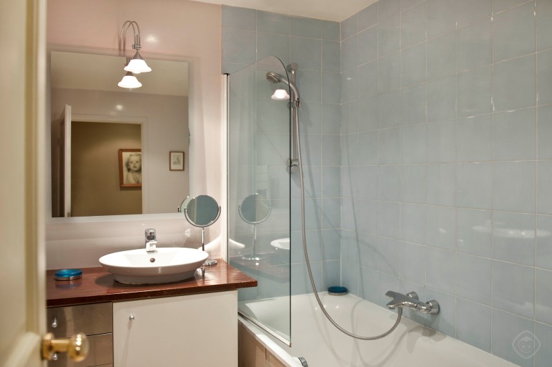 Bathroom with Sink, Shower and Bathtub Chic Saint Germain apartment Paris